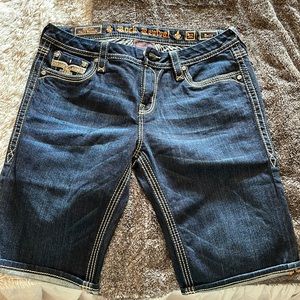 Women’s Rock Revival blue curvy Bermuda shorts.